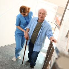 elderly woman in a wheelchair with her caregiver